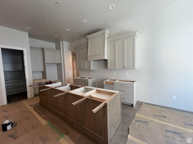 551 W Summerhill Ln, Centerville, UT 84014 - kitchen featuring a center island and wood finished floors