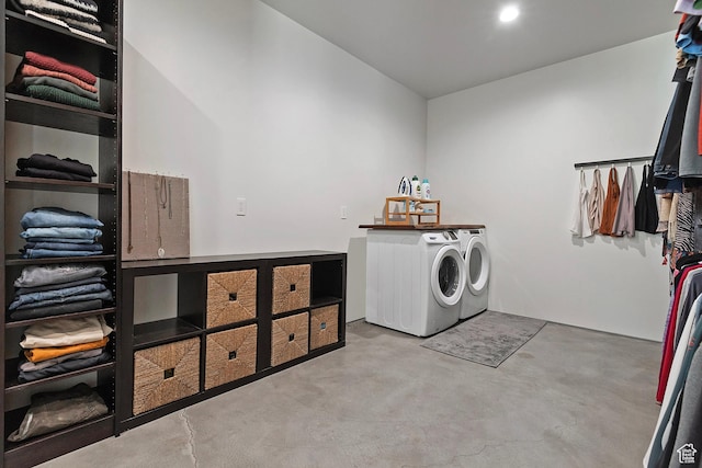 clothes washing area featuring independent washer and dryer and laundry area