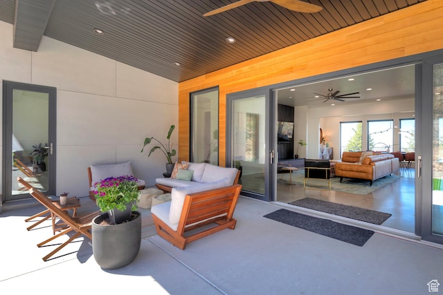 view of patio featuring an outdoor hangout area and a ceiling fan