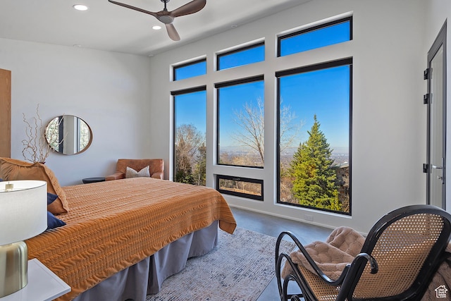 bedroom with baseboards, ceiling fan, and recessed lighting
