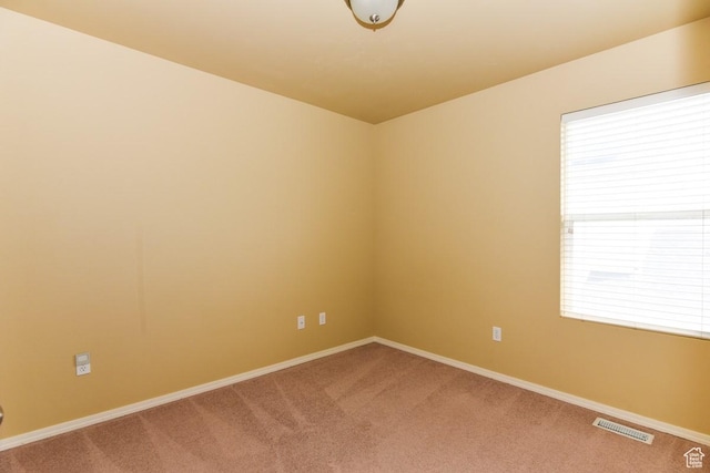 202 E Aparicio Dr, Tooele, UT 84074 - empty room featuring carpet floors, baseboards, and visible vents