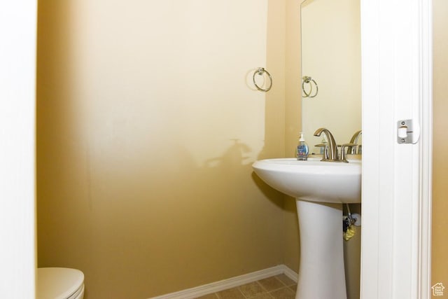 202 E Aparicio Dr, Tooele, UT 84074 - half bathroom featuring baseboards and toilet