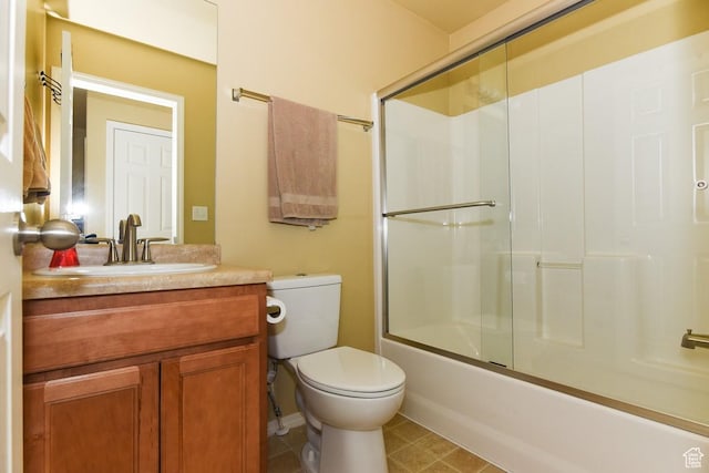 202 E Aparicio Dr, Tooele, UT 84074 - full bathroom featuring toilet, shower / bath combination with glass door, tile patterned floors, and vanity