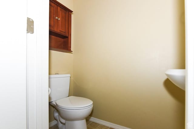 202 E Aparicio Dr, Tooele, UT 84074 - bathroom with baseboards and toilet