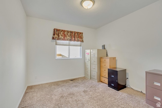 unfurnished bedroom with baseboards and carpet