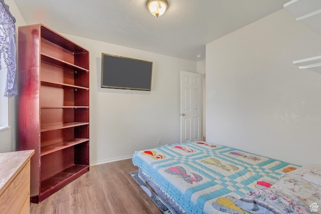 bedroom featuring light wood-style floors