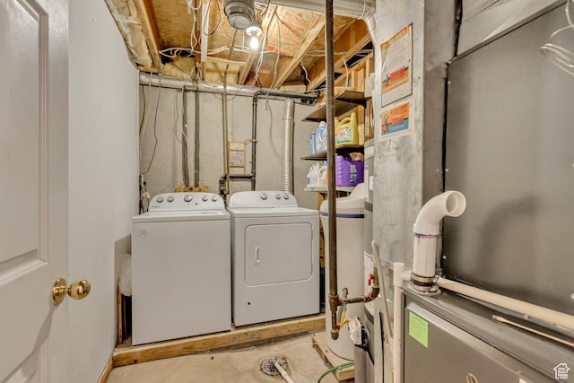 laundry room with washing machine and clothes dryer and laundry area