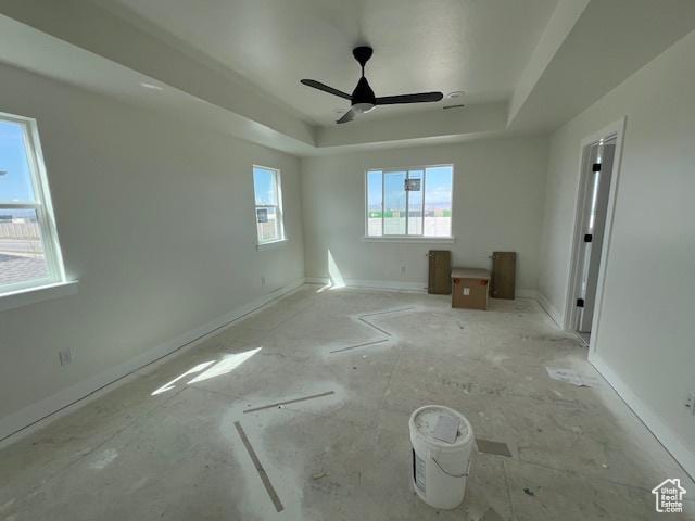 2131 N 725 W, Centerville, UT 84014 - unfurnished bedroom featuring a tray ceiling, ceiling fan, and baseboards