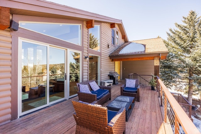 wooden deck featuring outdoor lounge area and grilling area