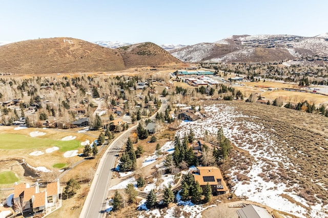bird's eye view with a mountain view and view of golf course