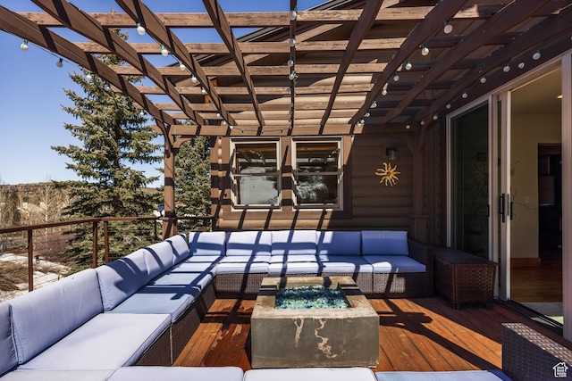 deck with an outdoor living space with a fire pit and a pergola