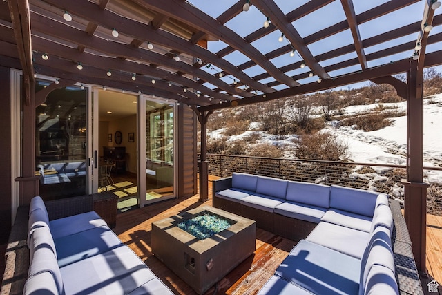 snow covered patio with a pergola and an outdoor living space with a fire pit