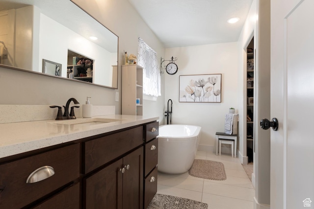 185 W 200 N, Centerfield, UT 84622 - bathroom with tile patterned floors, vanity, a spacious closet, a freestanding bath, and recessed lighting