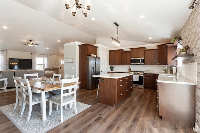 185 W 200 N, Centerfield, UT 84622 - kitchen with a kitchen island, appliances with stainless steel finishes, a sink, open floor plan, and vaulted ceiling