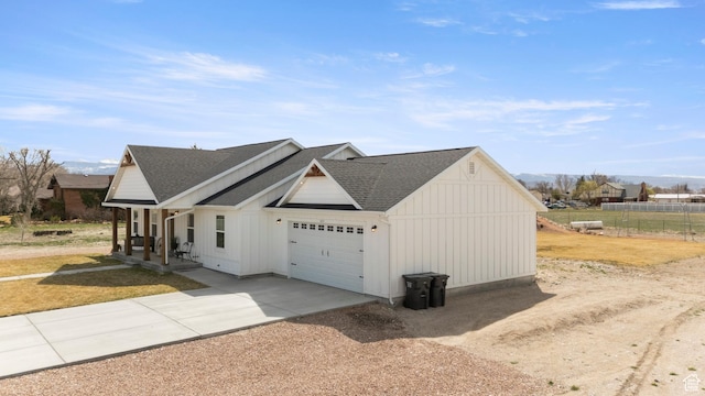 185 W 200 N, Centerfield, UT 84622 - view of front of house with driveway, covered porch, roof with shingles, an attached garage, and board and batten siding