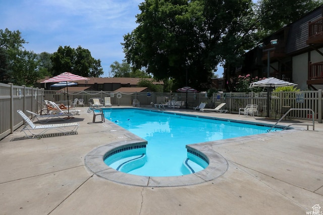 5560 S Willow Ln E Unit A, Murray, UT 84107 - community pool featuring fence and a patio area