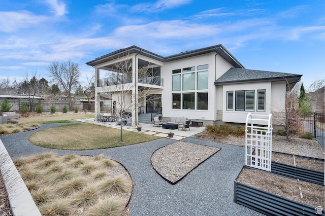 8165 S Willow Creek Cv E, Cottonwood Heights, UT 84093 - rear view of property featuring a balcony, stucco siding, fence, and a patio area