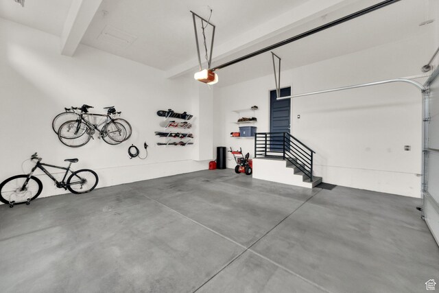 8165 S Willow Creek Cv E, Cottonwood Heights, UT 84093 - garage featuring a garage door opener