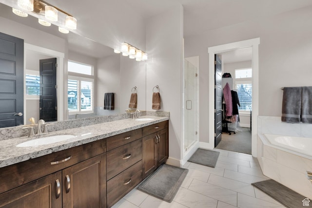 8165 S Willow Creek Cv E, Cottonwood Heights, UT 84093 - bathroom featuring double vanity, a wealth of natural light, a sink, and a shower stall