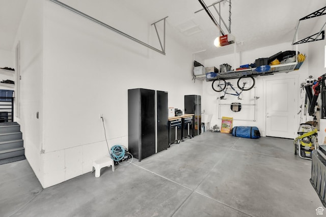 8165 S Willow Creek Cv E, Cottonwood Heights, UT 84093 - garage featuring a garage door opener