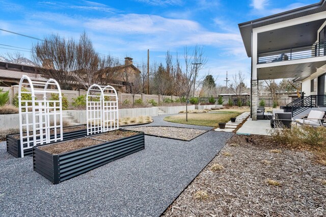 8165 S Willow Creek Cv E, Cottonwood Heights, UT 84093 - view of yard with a patio area, fence, and a vegetable garden