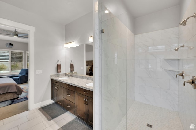 8165 S Willow Creek Cv E, Cottonwood Heights, UT 84093 - ensuite bathroom with tile patterned flooring, a tile shower, a sink, double vanity, and ensuite bathroom