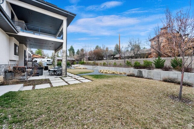 8165 S Willow Creek Cv E, Cottonwood Heights, UT 84093 - view of yard featuring a balcony, fence, and a patio area