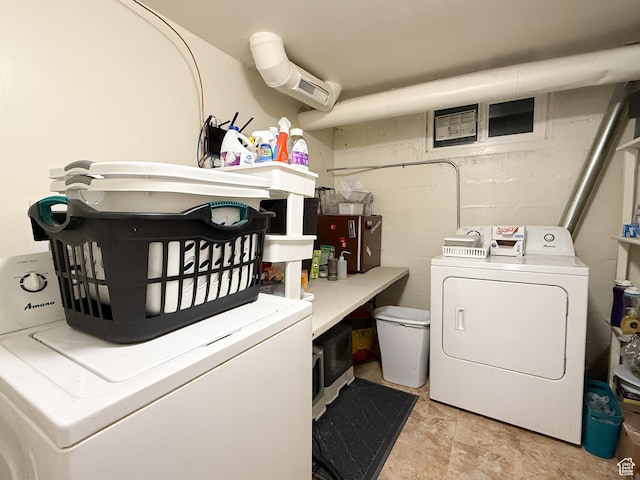 laundry room featuring washing machine and dryer