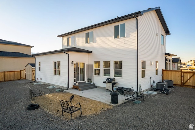 585 W 20 N, Hyrum, UT 84319 - back of house featuring a gate, fence, entry steps, and a patio area