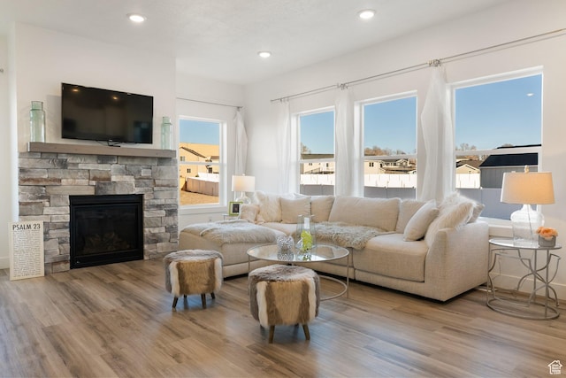 585 W 20 N, Hyrum, UT 84319 - living room featuring recessed lighting, a fireplace, and wood finished floors