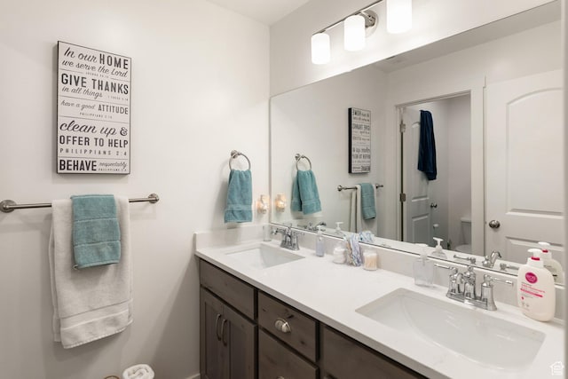 585 W 20 N, Hyrum, UT 84319 - full bathroom with toilet, a sink, and double vanity