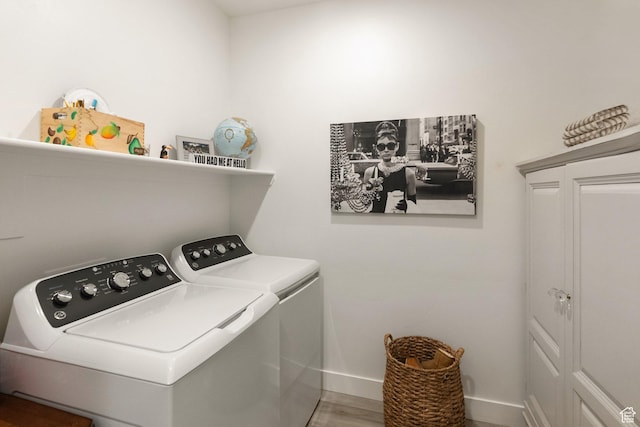585 W 20 N, Hyrum, UT 84319 - laundry room with baseboards, wood finished floors, washing machine and clothes dryer, and laundry area