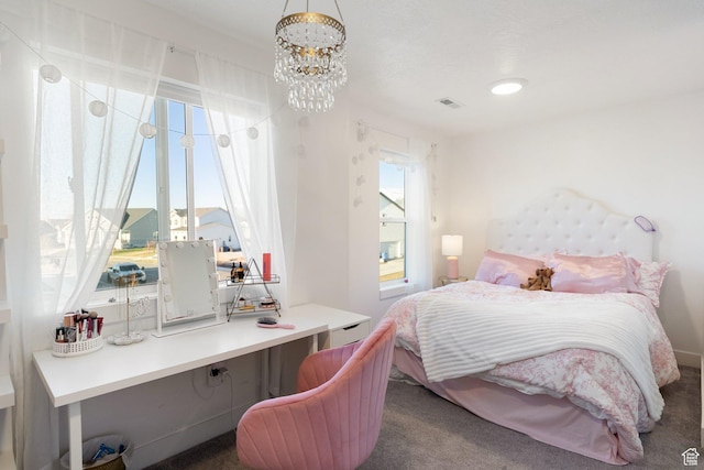 585 W 20 N, Hyrum, UT 84319 - bedroom with an inviting chandelier, carpet flooring, multiple windows, and visible vents