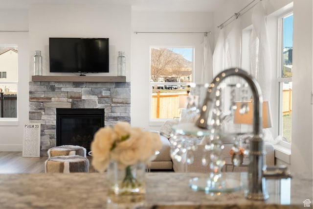 585 W 20 N, Hyrum, UT 84319 - living room with wood finished floors and a stone fireplace