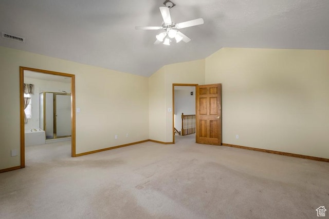 unfurnished bedroom with vaulted ceiling, carpet, baseboards, and a ceiling fan