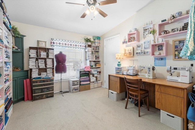 office featuring vaulted ceiling, light colored carpet, and ceiling fan