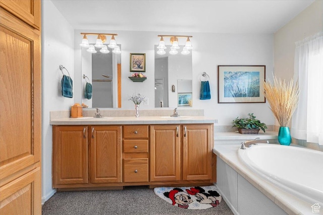 bathroom with double vanity, a sink, and a garden tub