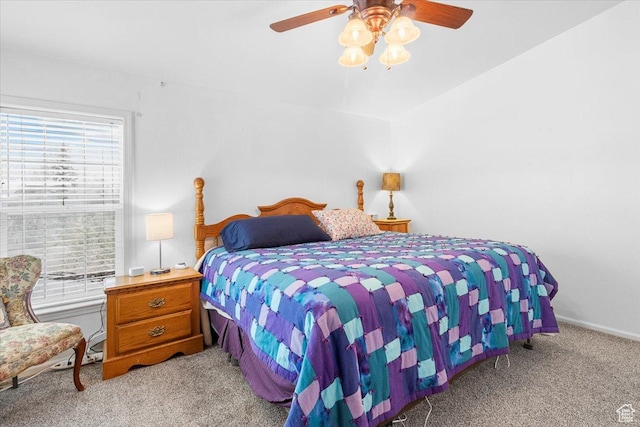 bedroom with baseboards, light colored carpet, and ceiling fan