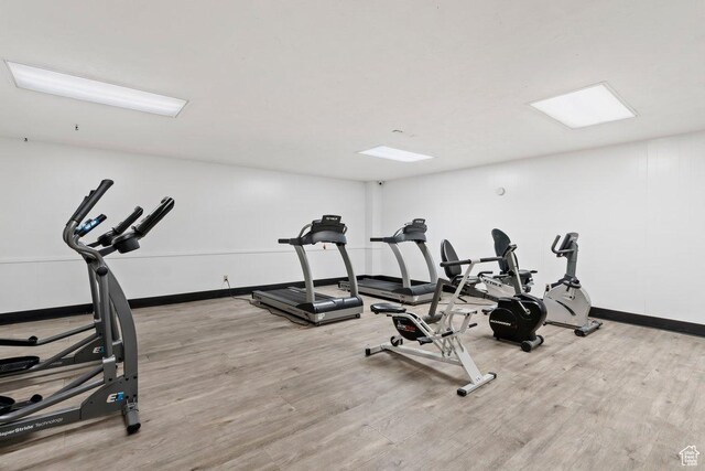 241 N Vine St Unit 606E, Salt Lake City, UT 84103 - workout area featuring baseboards and wood finished floors