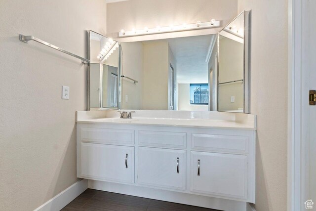 241 N Vine St Unit 606E, Salt Lake City, UT 84103 - bathroom featuring baseboards and vanity