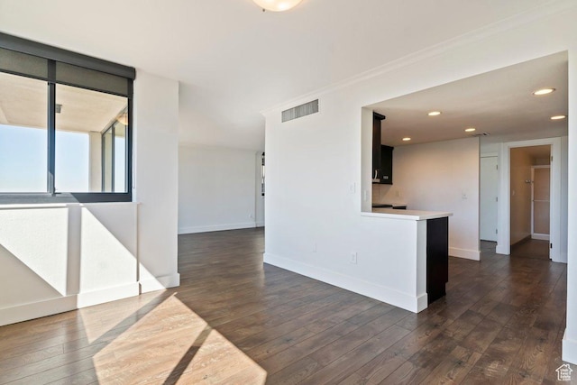 241 N Vine St Unit 606E, Salt Lake City, UT 84103 - spare room featuring dark wood-style floors, visible vents, crown molding, and baseboards