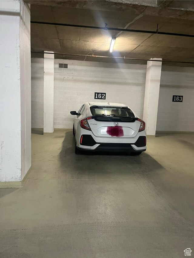 241 N Vine St Unit 606E, Salt Lake City, UT 84103 - parking deck featuring concrete block wall and visible vents