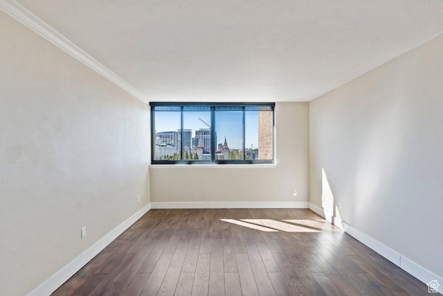 241 N Vine St Unit 606E, Salt Lake City, UT 84103 - unfurnished room featuring baseboards, a view of city, ornamental molding, and wood finished floors