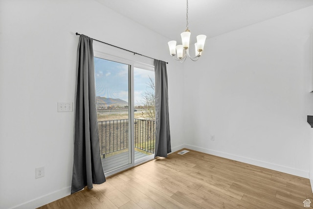 866 S Brubaker Way, Santaquin, UT 84655 - unfurnished room featuring a chandelier and wood finished floors