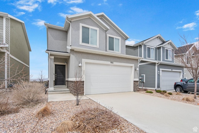 866 S Brubaker Way, Santaquin, UT 84655 - view of front facade featuring stucco siding, a garage, concrete driveway, and stone siding