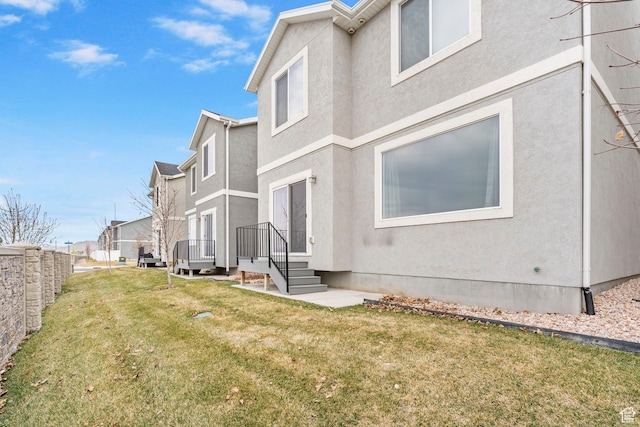 866 S Brubaker Way, Santaquin, UT 84655 - view of side of home featuring stucco siding and a lawn