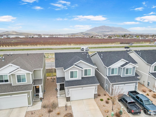 866 S Brubaker Way, Santaquin, UT 84655 - view of front of home with a shingled roof, a mountain view, a garage, and concrete driveway