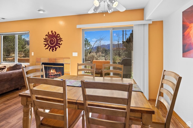 3418 E La Camino, Moab, UT 84532 - dining space featuring visible vents, ceiling fan, light wood-style flooring, and a glass covered fireplace