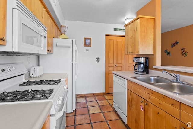 3418 E La Camino, Moab, UT 84532 - kitchen featuring light countertops, white appliances, light tile patterned floors, baseboards, and a sink