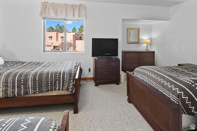 3418 E La Camino, Moab, UT 84532 - bedroom featuring baseboards and light carpet